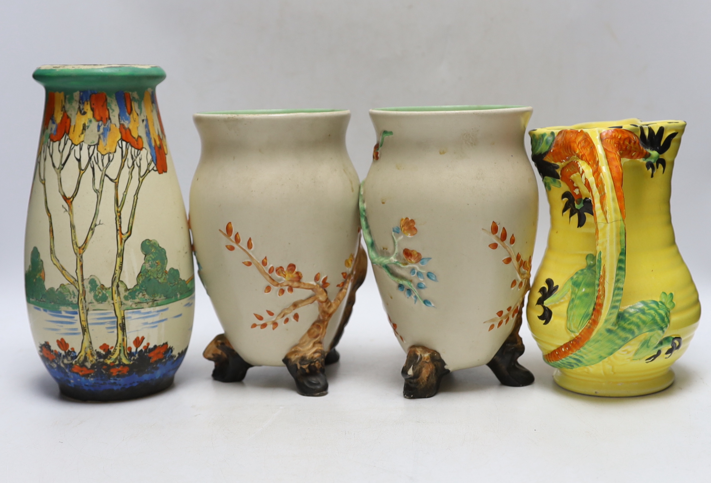 A pair of Clarice Cliff pottery vases, Ducal vase and a jug, largest 23cm high